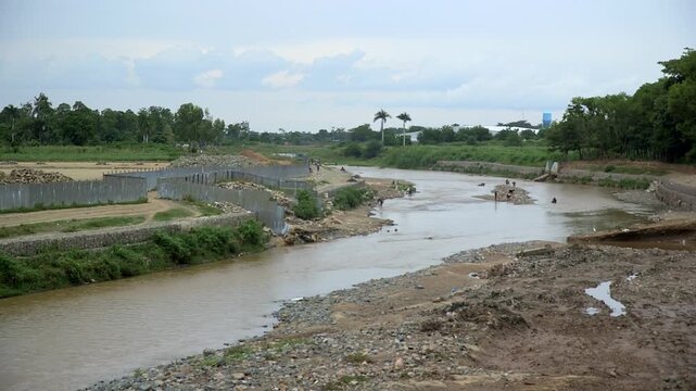 Massacre River on the border between Dajab&oacute;n, Dominican Republic, and Haiti, showing the river channel and surrounding embankments.