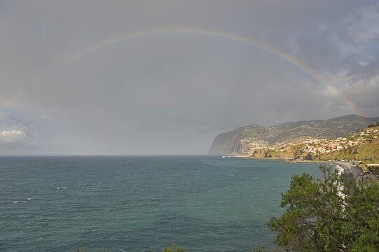 Rainbow over the ocean and the cliffs of Cabo Girao, Camara de Lobos, Madeira, Portugal