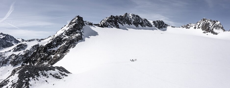 Aerial view of a group of alpinists in the high mountains with the glacier Lisener Ferner, Brunnenkogel and L&uuml;sener Spitze in the background, mountains in winter, Stubai Alps, Tyrol, Austria