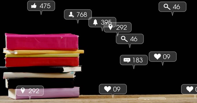 Stack of notebooks sitting on wooden table, social media buzz sparking icon clouds around notebooks