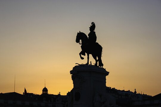 Silhouette of the equestrian statue of Jos&eacute; I at sunset, Pra&ccedil;a do Com&eacute;rcio, Lisbon, Portugal