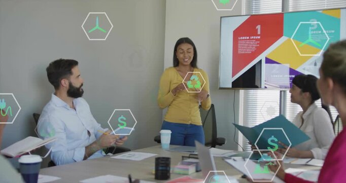 Slide appearing, presenter standing, gesturing and pointing, briefing team with green hex icons