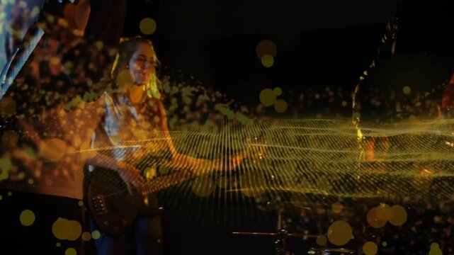 Band playing on stage, guitar strum initiating waveform and golden bokeh revealing band for crowd