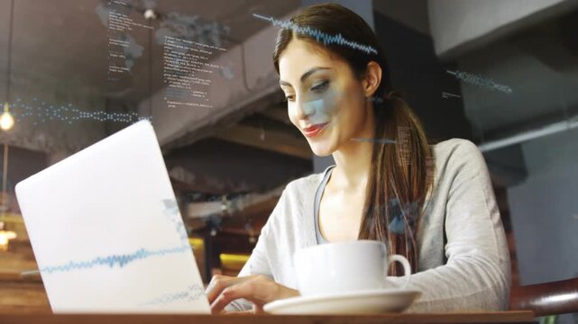 Woman typing at laptop at cafe, causing waveform code overlays reflecting on face, analyzing data