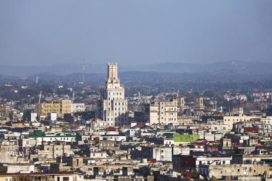 View over sea of houses with tower of the Cuban telephone company, Empresa de Telecomonicaciones de Cuba S.A., capital Havana, Havana Province, Greater Antilles, Caribbean, Cuba
