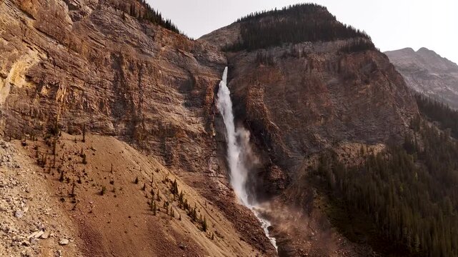 Cinematic aerial view of Takakkaw Falls, one of Canada's highest waterfalls, plunging from Daly Glacier in Yoho National Park, British Columbia, Canada. Typical High quality 4k footage