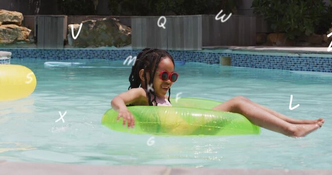 Girl paddling and kicking, starting green tube drifting in yard pool for play, sporting red shades
