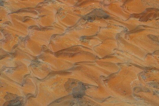 Dry riverbed, reddish clay, Landmannalaugar, Fjallabak, Icelandic Highlands, Iceland