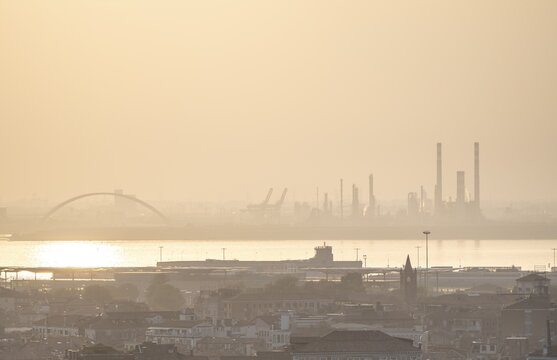 Smog, houses in fog, harbour and industrial area in the back, Venice, Veneto, Italy