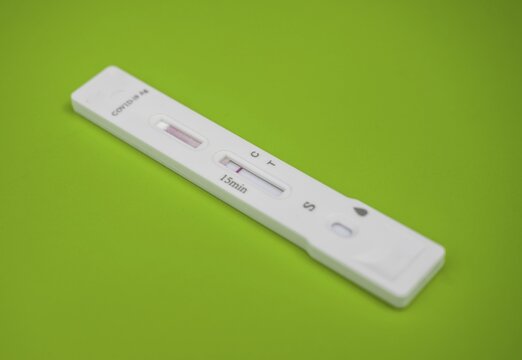 Test cassette, Covid-19 antigen test kit, negative test result, self-test, Sars-CoV-2, Corona virus, pandemic, exempted, green background