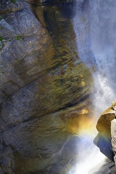 Rainbow in a waterfall at Gelmerstausee reservoir, Guttannen, Canton of Bern, Switzerland