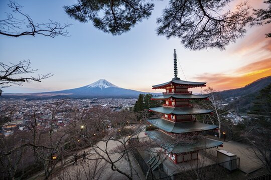 Five-story pagoda of a Shinto Shrine, Chureito Pagoda, with views of Fujiyoshida City and Mount Fuji volcano at sunset, Arakura Fuji Sengen Shrine, Arakurayama Sengen Park, Yamanashi Prefecture, Japan