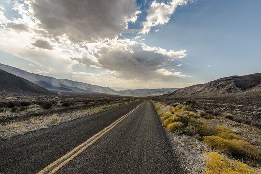 Highway, street with dramatic clouds above, Death Valley, Death Valley National Park, California, USA