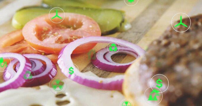 Vertical video: Camera tracking right shifting burger focus, green eco icons showing food eco data