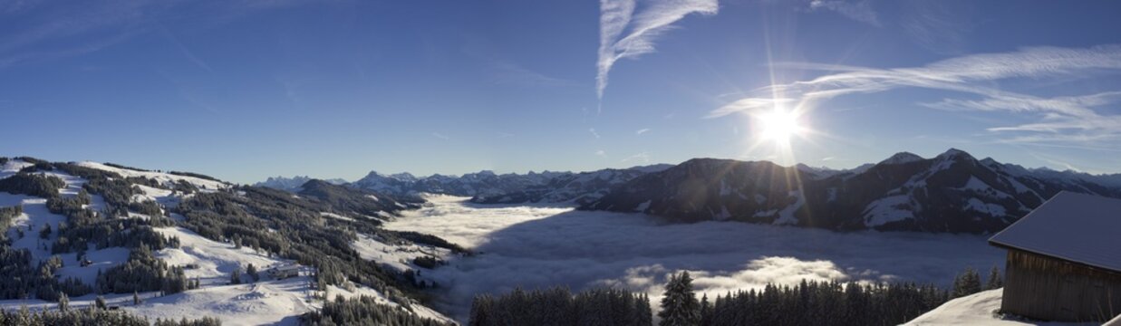 Alpine panorama in afternoon sun, high fog covering the valley, Hochbrixen, Brixen Im Thale, Tyrol, Austria