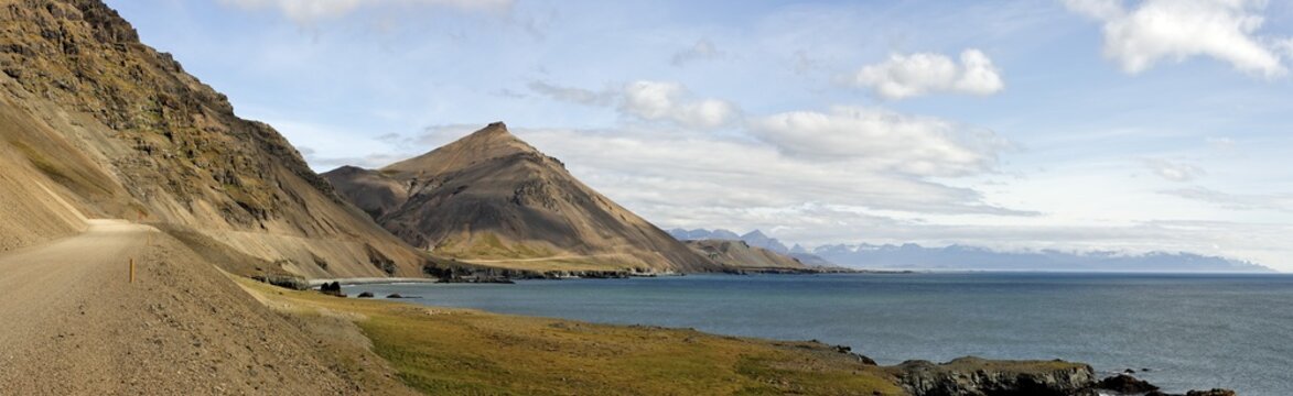 Gravel road on the southern coast between Hoefn and Dj&uacute;pivogur, Iceland, Atlantic Ocean