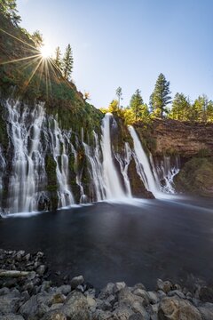 Solar star above waterfall, long-term image, McArthur-Burney Falls Memorial State Park, California, USA