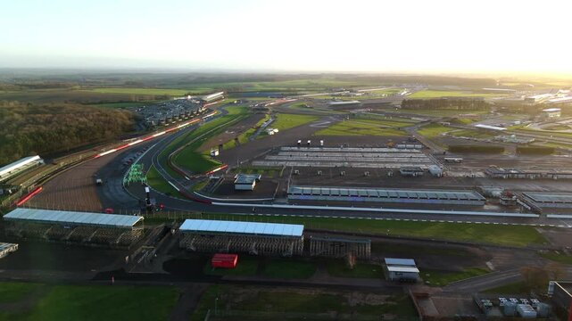 Drone view of the legendary British Motorsports complex at Silverstone featuring the racetrack and grandstands in the winter season.