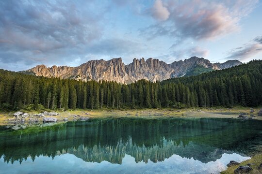 Latemar Group reflected in the Lake of Carezza, Lago di Carezza,  Mountain peaks Eastern Latemar Peak, Diamond Tower, Col Coron,  Catfish furnace, Bolzano, South Tyrol, Italy