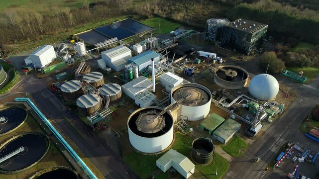 Aerial view showing the complex layout of a water purification works in Milton Keynes, with high-detail shots of secondary treatment stages, filtration lagoons, and liquid waste management.