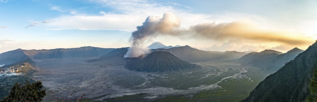 Caldera Tengger, view of volcanoes at sunset, smoking volcano Gunung Bromo, with Mt. Batok, Mt. Kursi, Mt. Gunung Semeru, National Park Bromo-Tengger-Semeru, Java, Indonesia