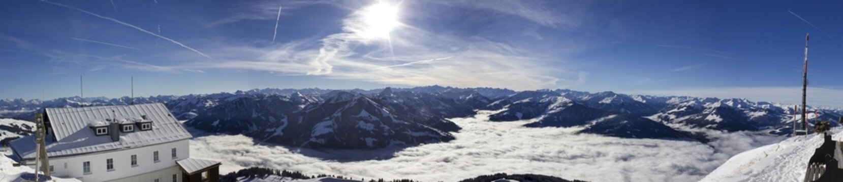 Alps in winter high, fog covering the valley, view from the Hohe Salve towards Hopfgarten Westendorf, 1828m, Wilder Kaiser-Brixental resort, Tyrol, Austria