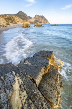 Waves crashing against rocks, sandy beach with rocky cliffs, Paralia Paradisos, Kos, Dodecanese, Greece