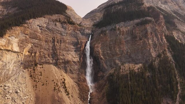 Cinematic aerial view of Takakkaw Falls, one of Canada's highest waterfalls, plunging from Daly Glacier in Yoho National Park, British Columbia, Canada. Typical High quality 4k footage