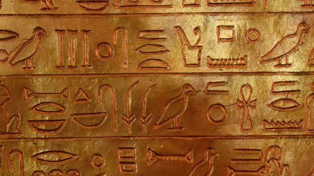 Amazing Hieroglyphs Carving on Golden Wall of Tomb Macro View of Antique Symbols Engraved on Plate