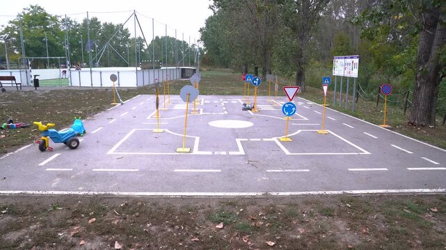 Children's traffic training area with toy tricycle teaching road safety