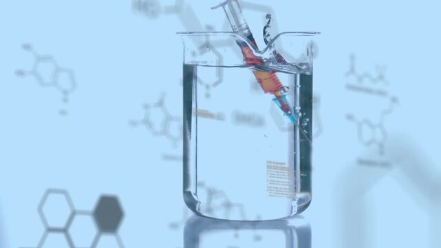 Animation of chemical formulas over syringe with reagent in glass on blue background