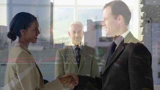 Composite video of diverse businessman and businesswoman shaking hands against tall buildings