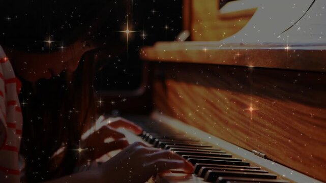 Girl positioning fingers on lower keys, playing melody on piano with star filter in music lesson