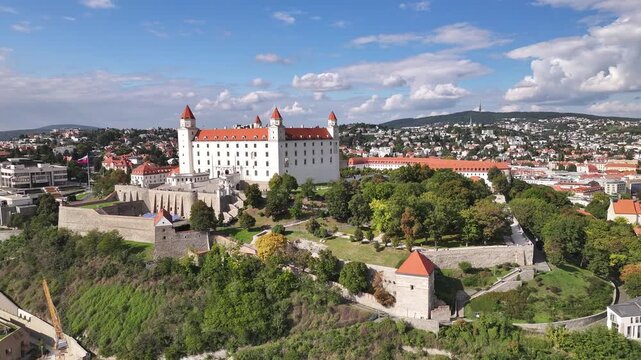 Aerial of Bratislava castle dominating city skyline landscape.