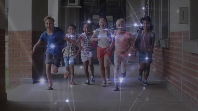 Group of six children running down school corridor, heading to class and causing nodes brightening