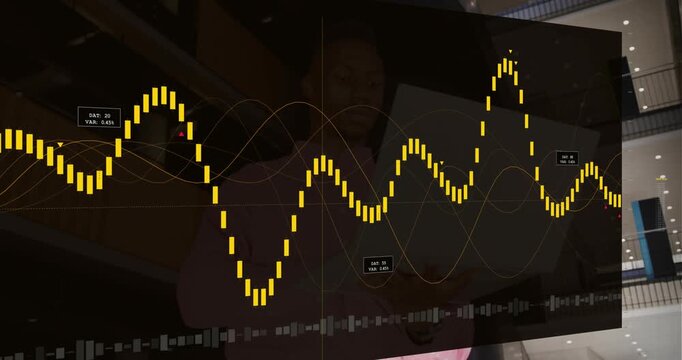 Man holding tablet as data panel appearing over him, animating yellow waveform and labels for data
