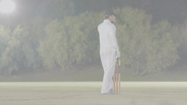 Bowler bowling, batter swinging bat for runs, keeper collecting, touching batter at cricket stumps