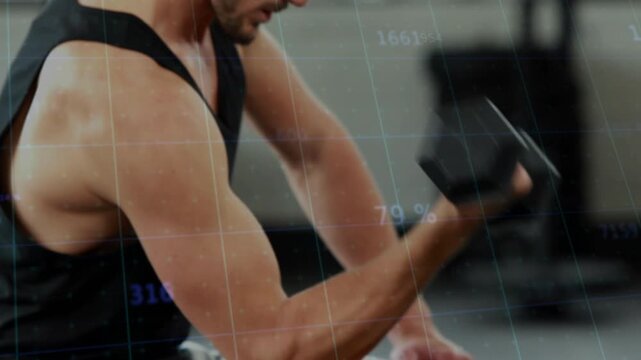 Male trainee in gym reaching dumbbell activating fitness HUD while curling single-arm tracking reps