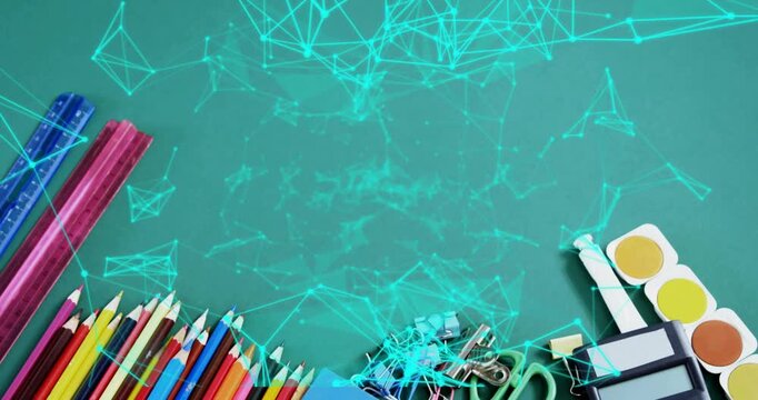 Turquoise net initiating pencils and clips appearing on teal desk, weaving over supplies for school