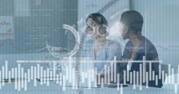 Left analyst speaking and gesturing colleague leaning and pointing finance charts overlaying trends