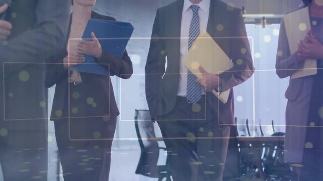 Corporate team walking toward meeting, holding blue binder and manila folder, HUD highlighting