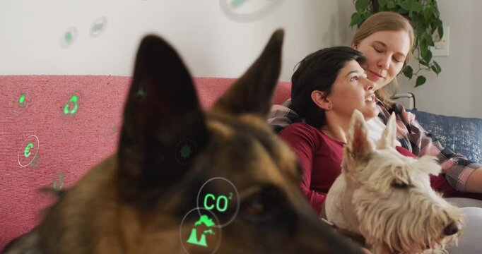 Dog shifting foreground two women leaning smiling as animated green icons float across for eco ad