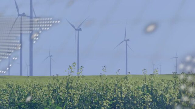 Terminal text scrolling over wind farm, dotted map sweeping diagonal to reveal horizon turbines