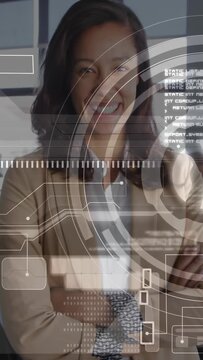 Vertical video: Business manager uncrossing and raising hand activating ringed HUD, accessing data