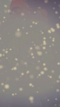 Vertical video: Singer singing into mic for music, flare sparking bokeh, face fading then clearing
