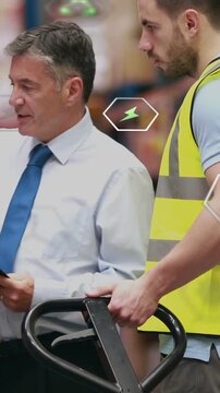 Vertical video: Mgr pointing clip guiding worker readying jack in warehouse, hex icons over clip