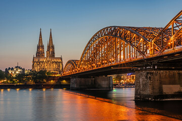 Cologne, Germany – April 25, 2025: Cologne Cathedral and Hohenzollern Bridge at sunset, Cologne (Köln), Germany © majonit