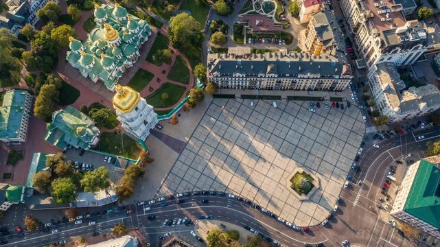 Aerial top down time lapse of Sofia Square in Kyiv, busy city life and moving shadows near the ancient cathedral. Majestic St. Sophia Cathedral and the main square of Kyiv, Ukraine