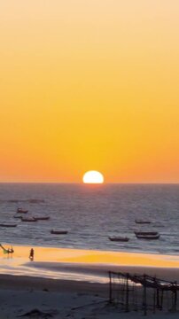 A stunning sunset with fishing boats moored