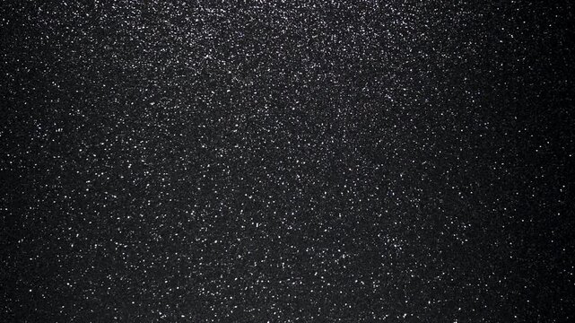 Fine Silver Glitter Dust Particles on Black Background